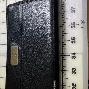 Cole Haan black leather zip-around wallet. Pre-loved and still in very good.